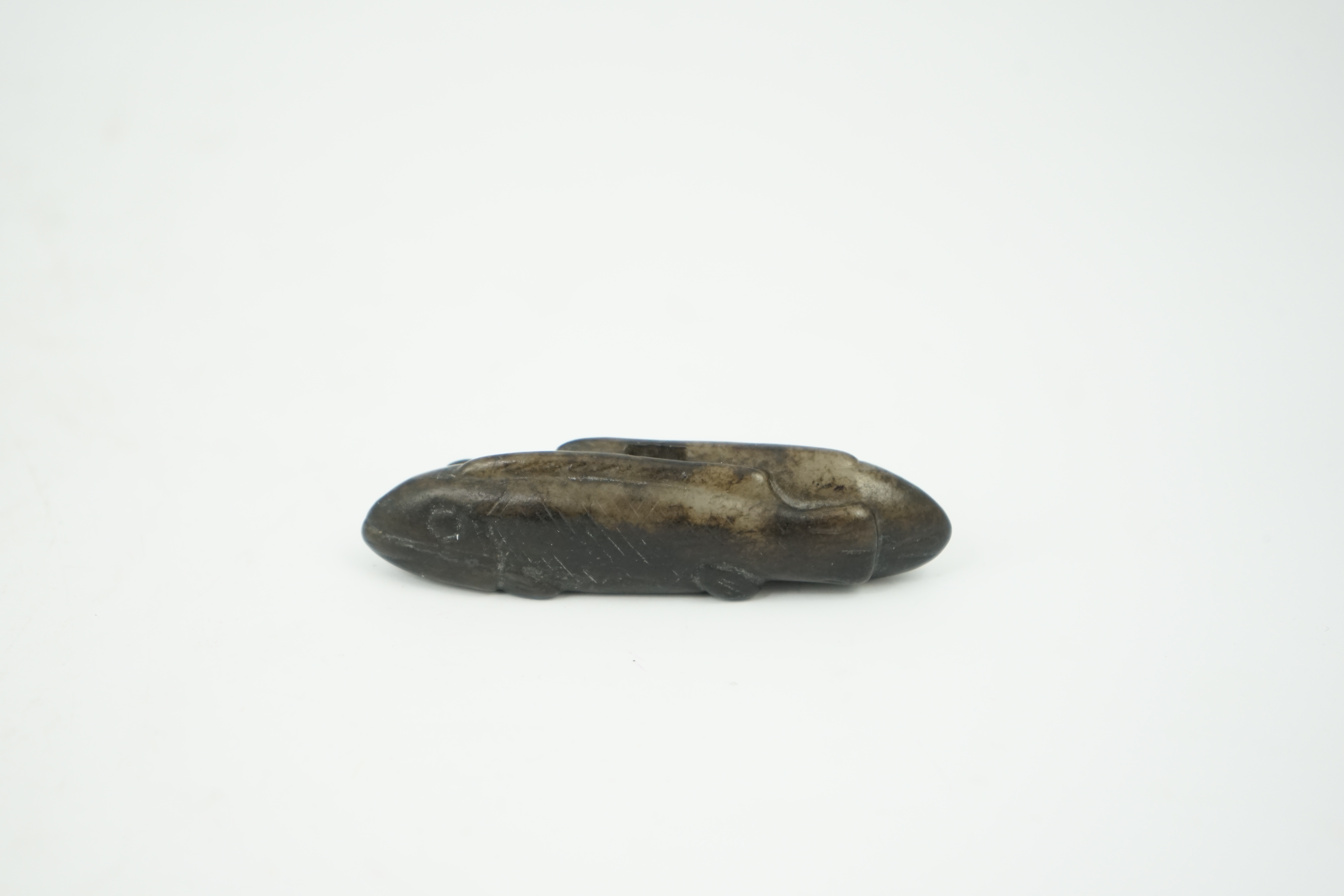 A Chinese black and white jade 'fish' sword fitting, Song or later